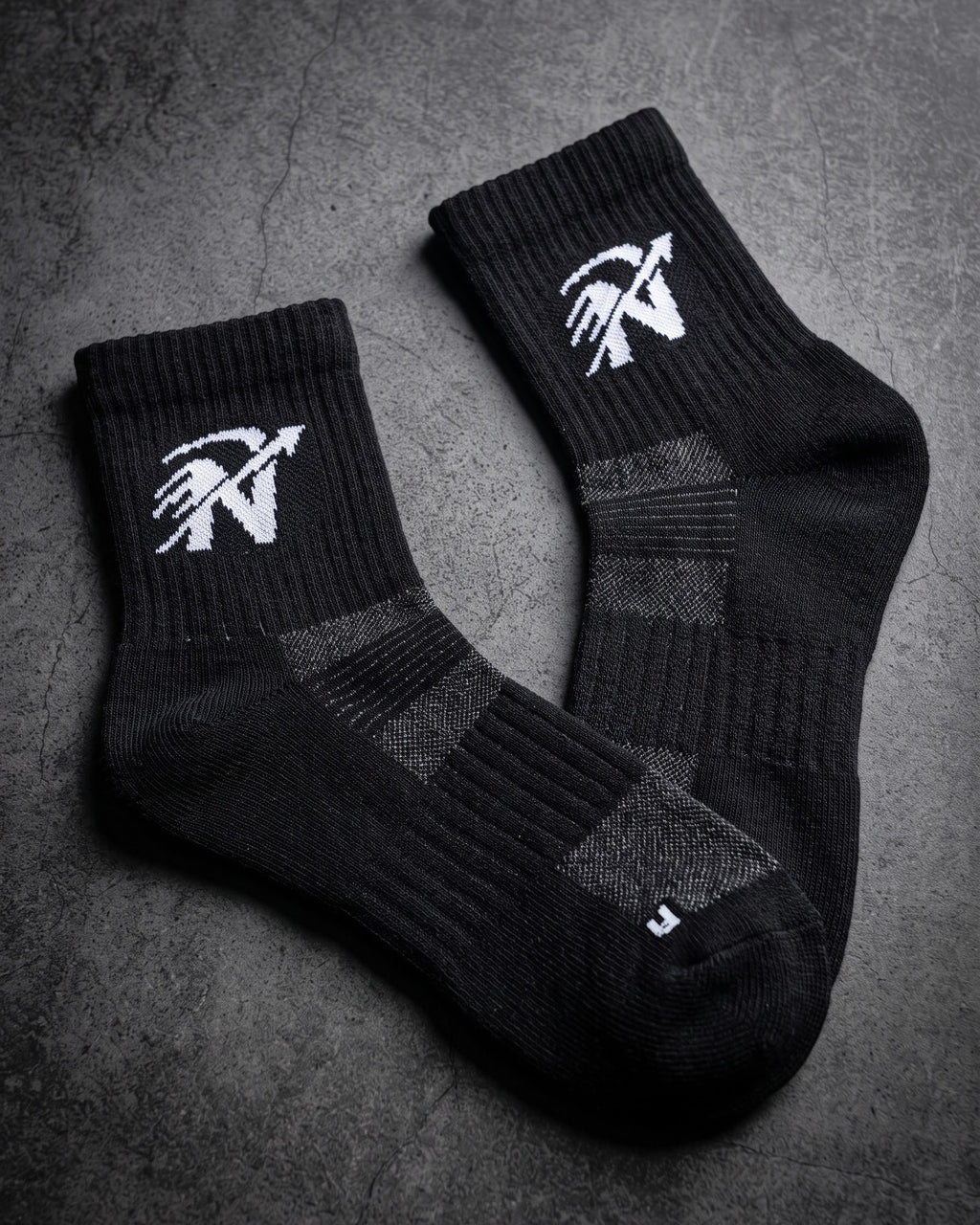Paire de chaussettes de running NEOSTRIDE MW-1 noires en laine mérinos, logo tricoté